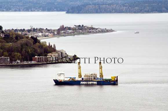 Seattle welcomes the Japanese vessel arriving in Eliott Bay, passing Alki Point after a two week voyage, transporting the Alaskan Way Tunnel Boring Machine.